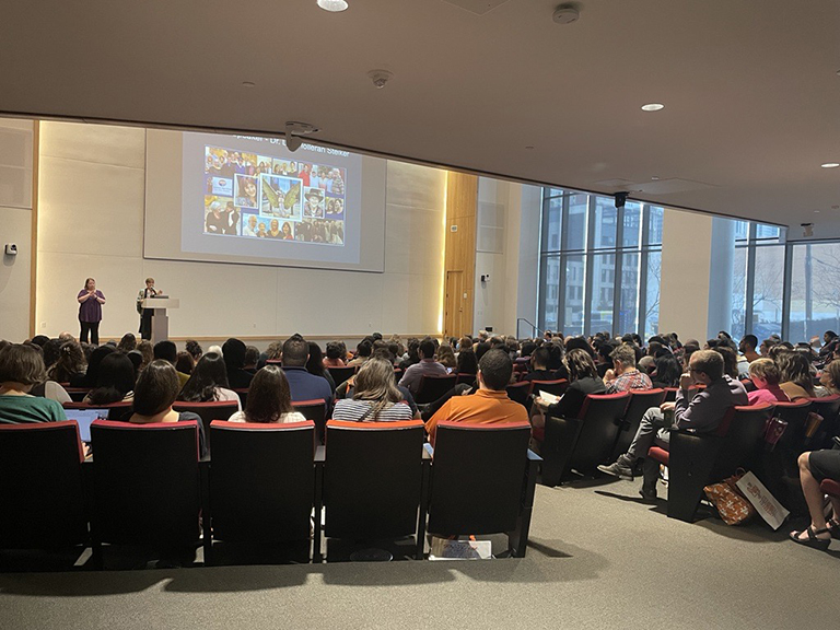 Professional development day event, auditorium filled with attendees